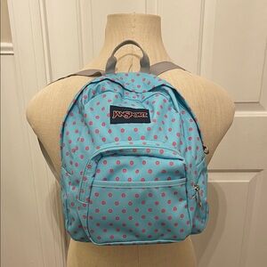 Mini Jansport backpack with front zipper and velcro pockets. Great condition.